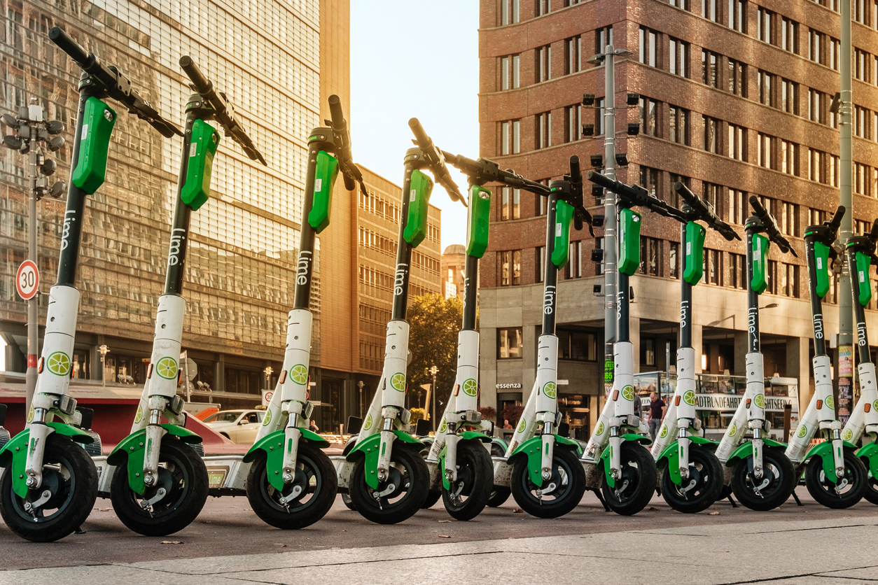 A row of e-scooters on a pavement in Berlin