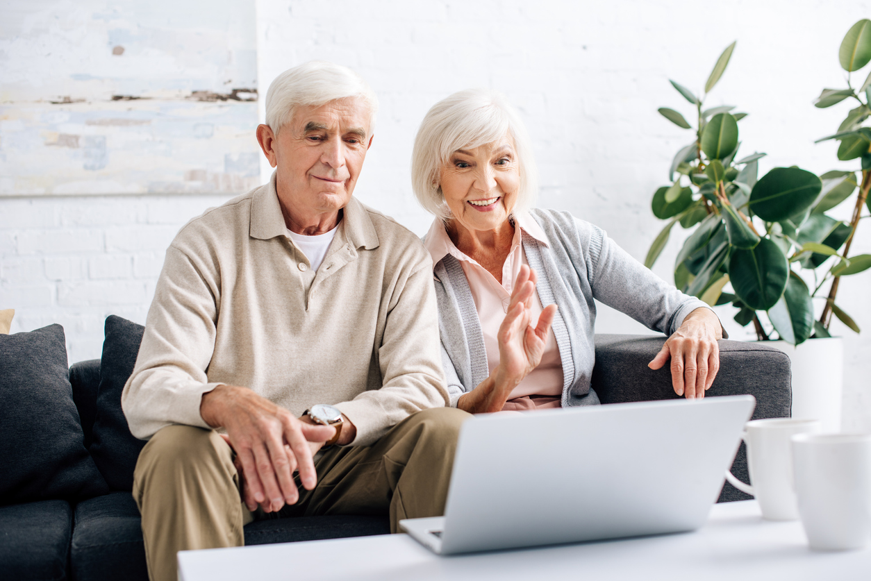 Elderly couple taking laptop video call