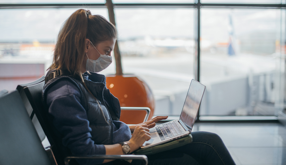 Masked lady on laptop