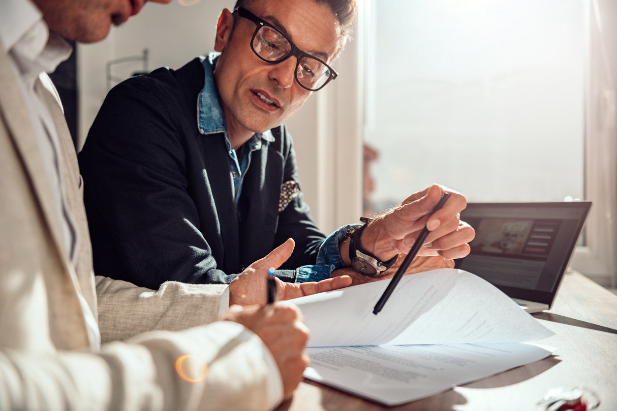 Personal injury lawyer looking over a statute with a client