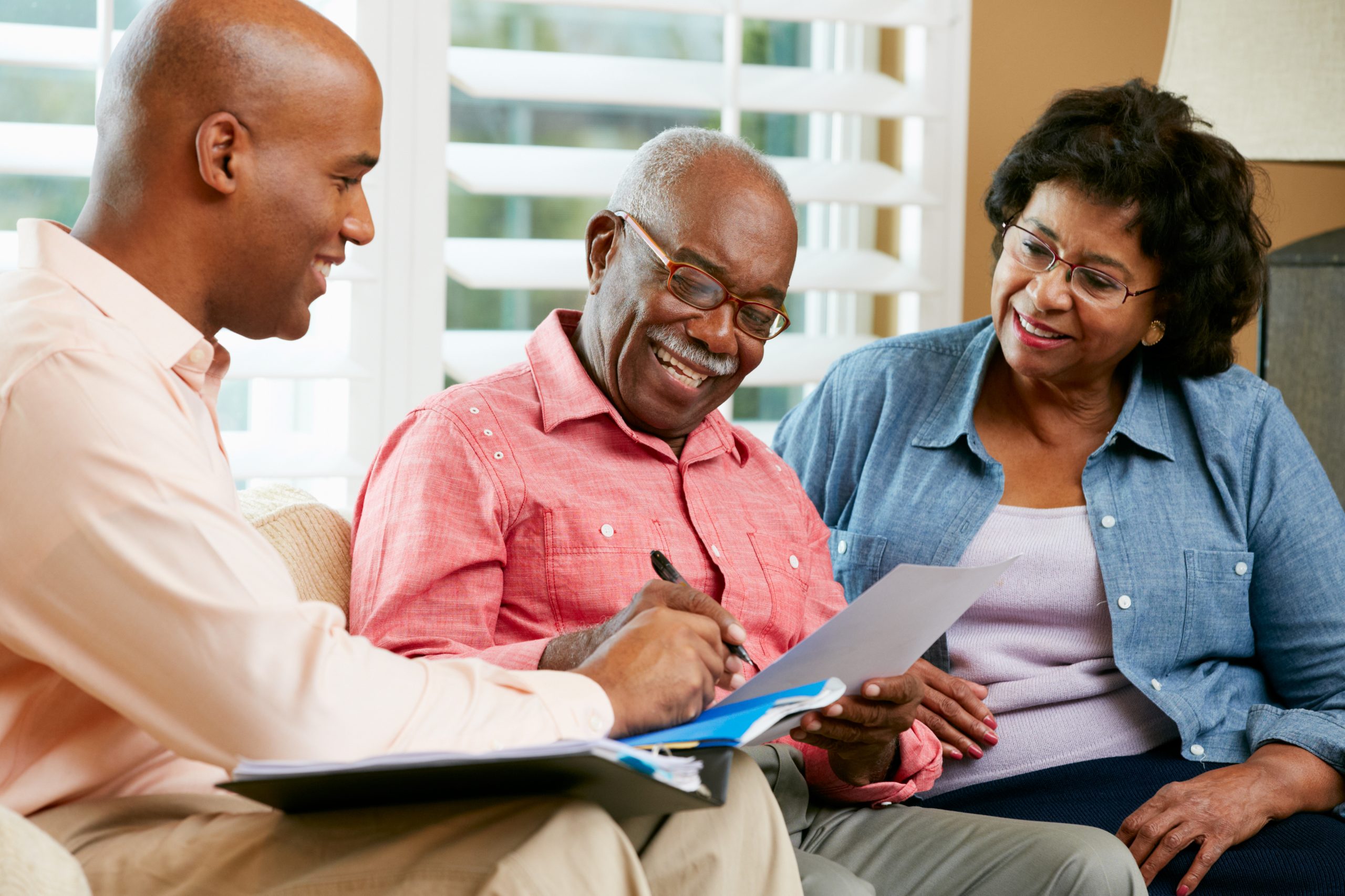 A senior couple meeting with an estate planning lawyer