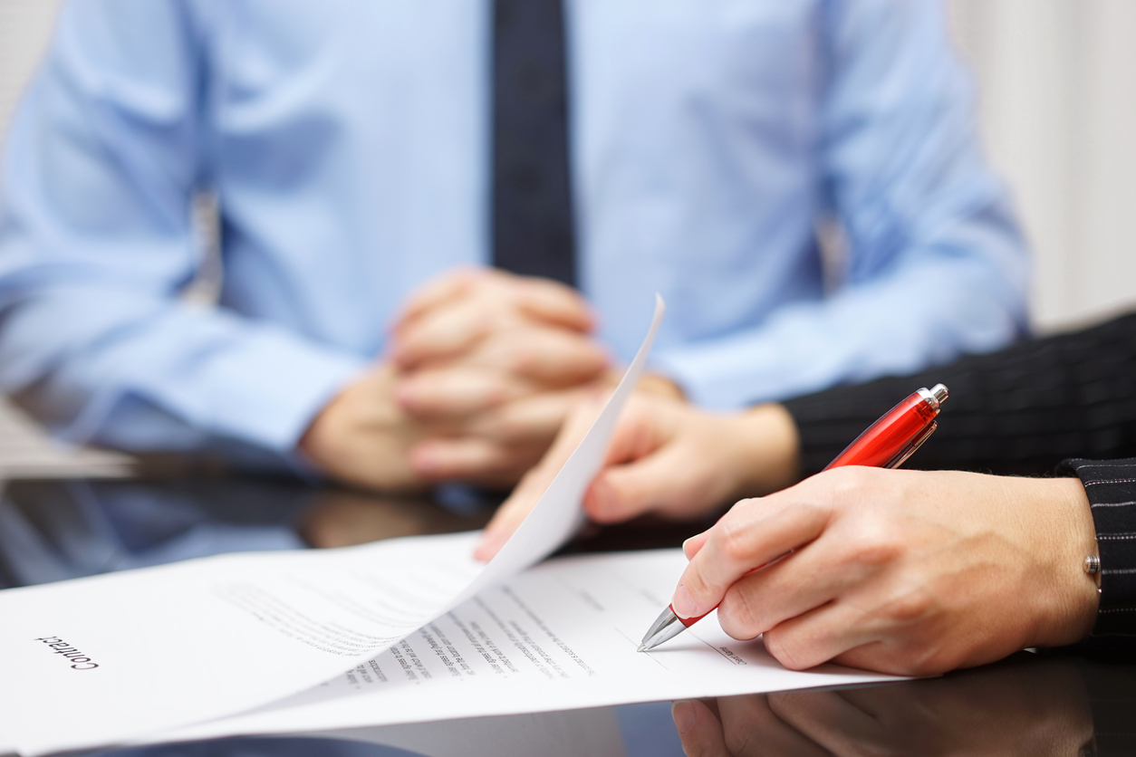 Woman is witnessed signing a will