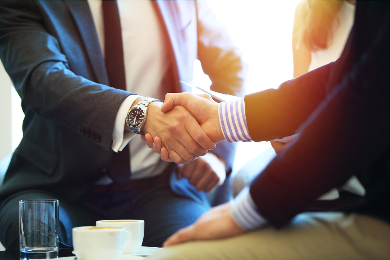 Attorneys shaking hands after a productive meeting