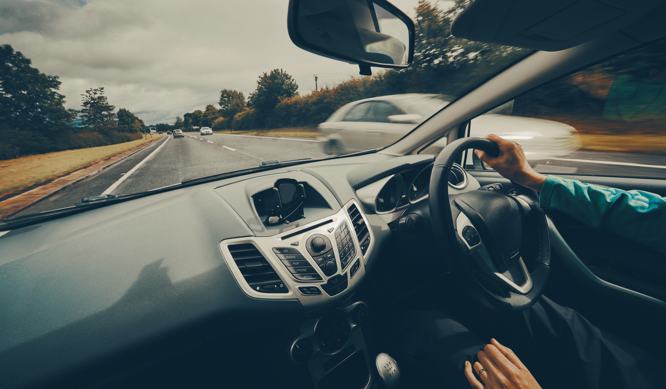 Female driver on single carriageway