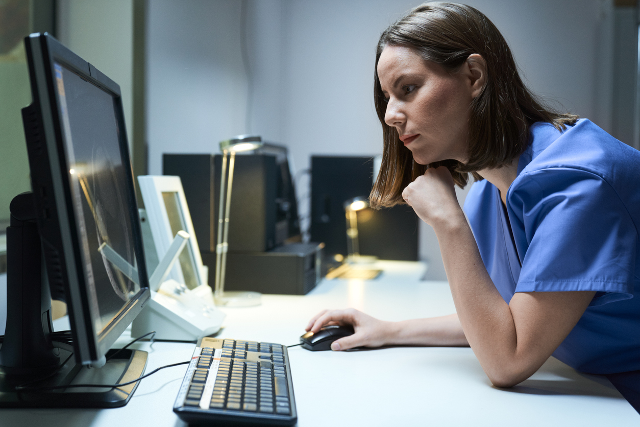 An NHS employee using a computer