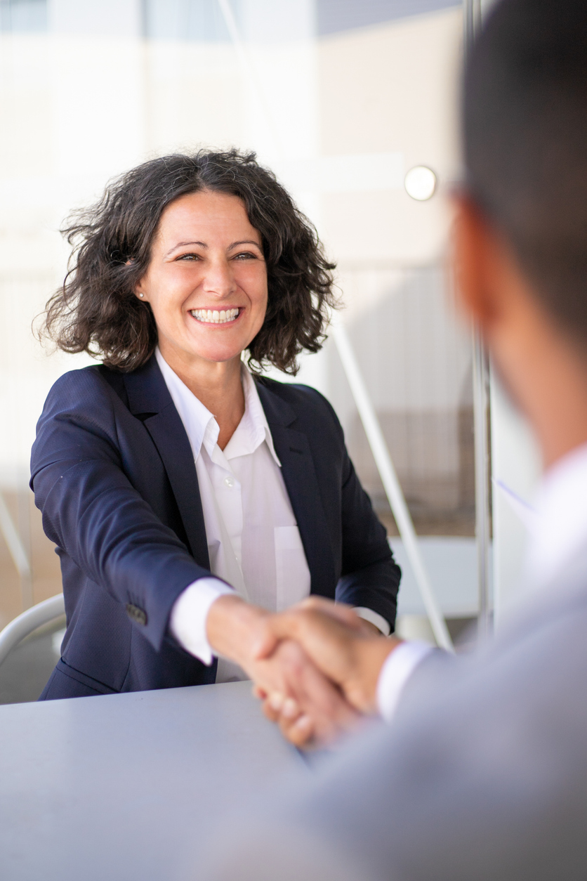 Happy successful business colleagues meeting outside