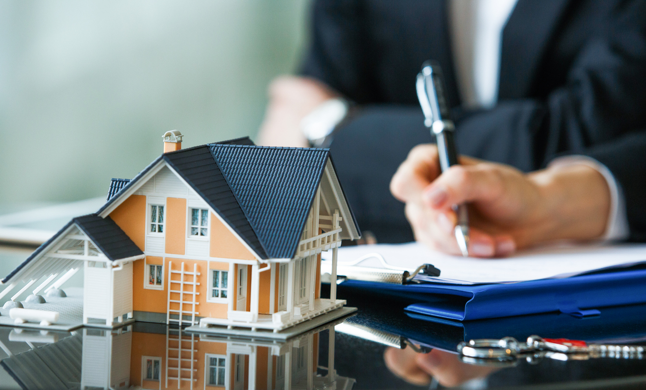 Man signing renters' insurance policy