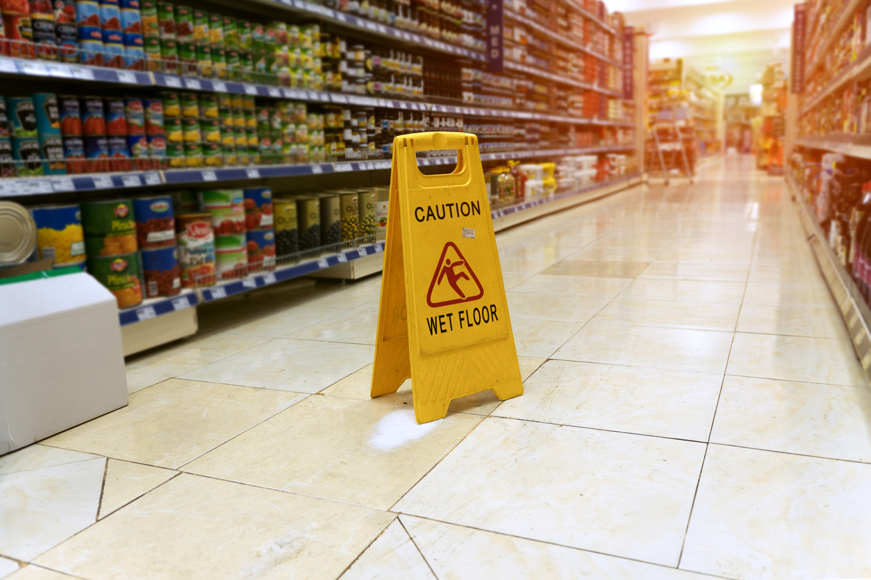 Wet floor sign in a supermarket