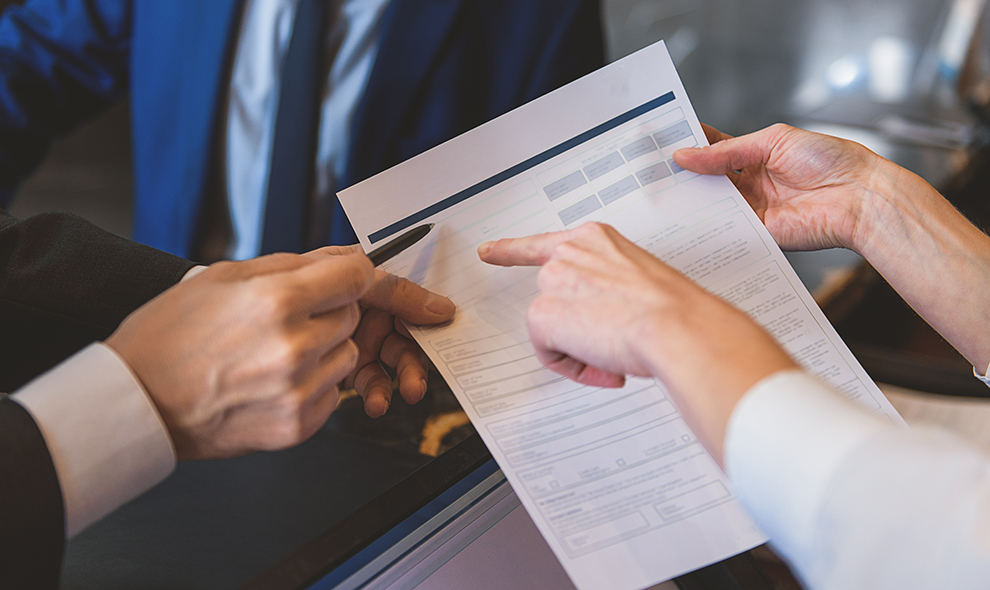 Woman holding form to fill in