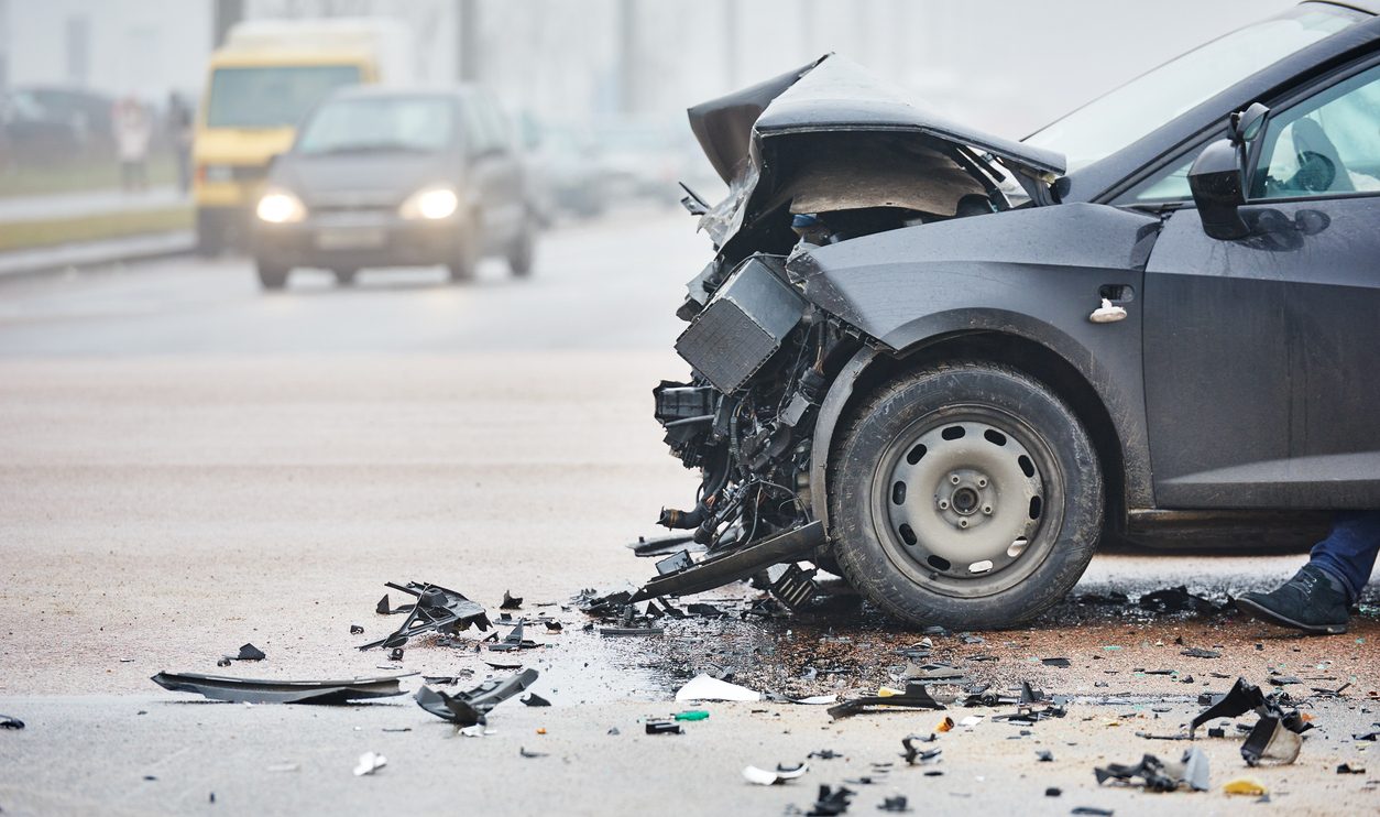 Damaged car in urban street