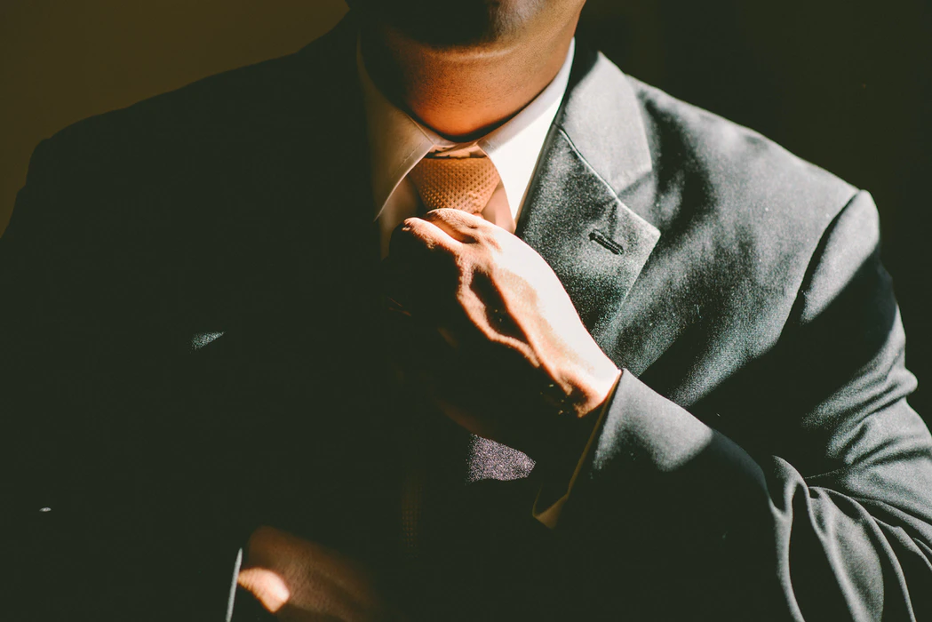 Lawyer straightening his tie