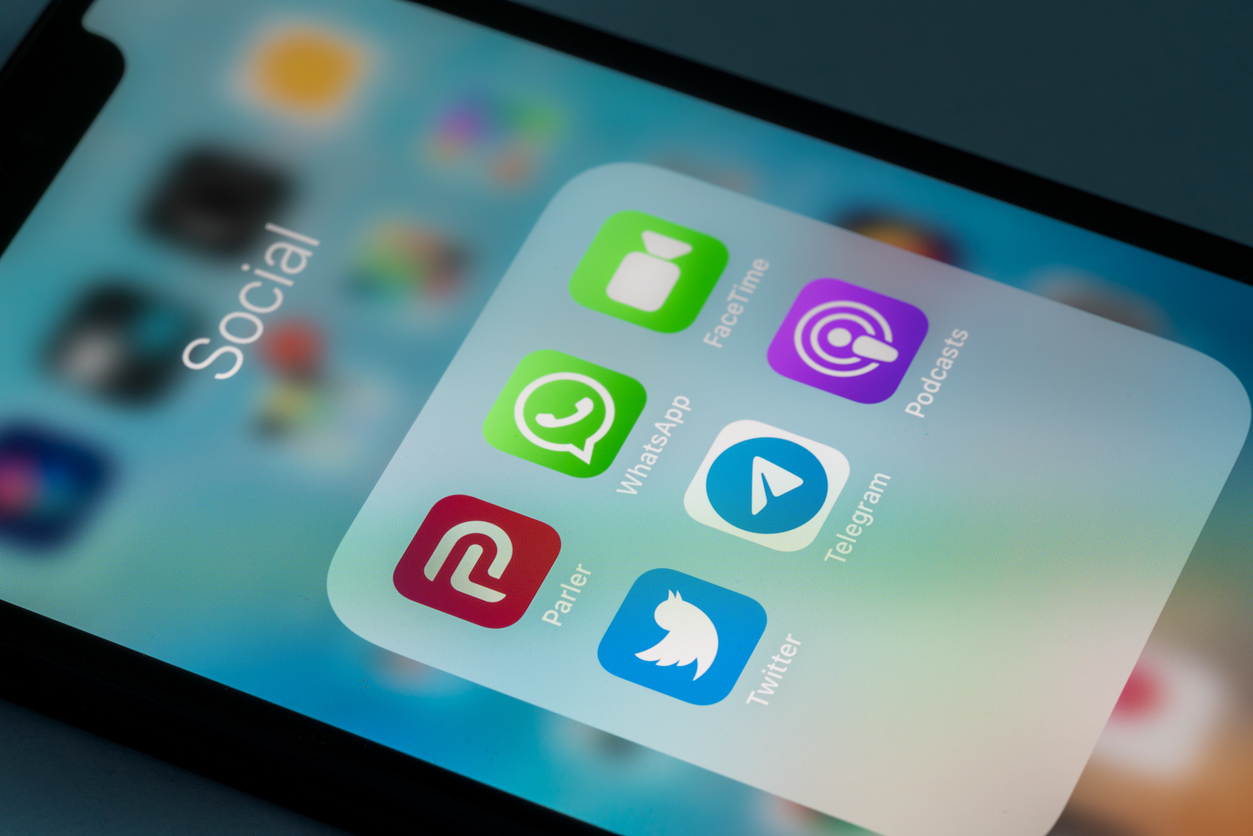 Smartphone displaying Parler, Twitter and Instagram apps