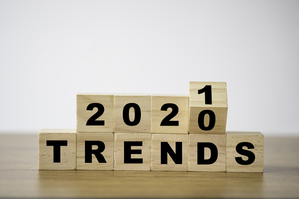 flipping 2020 to 2021 trends print screen on wooden block cubes. New idea business fashion popular and relevant topics.