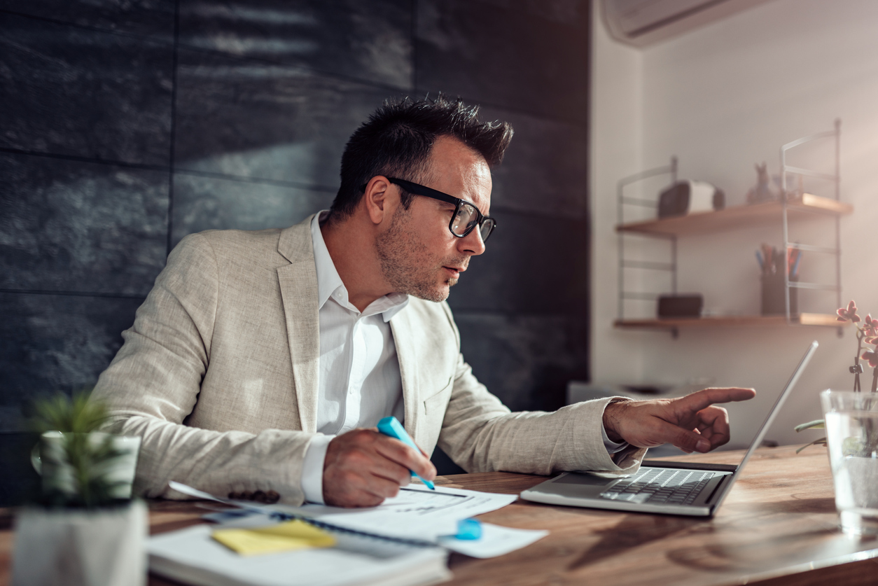 Lawyer in white suit working from home office