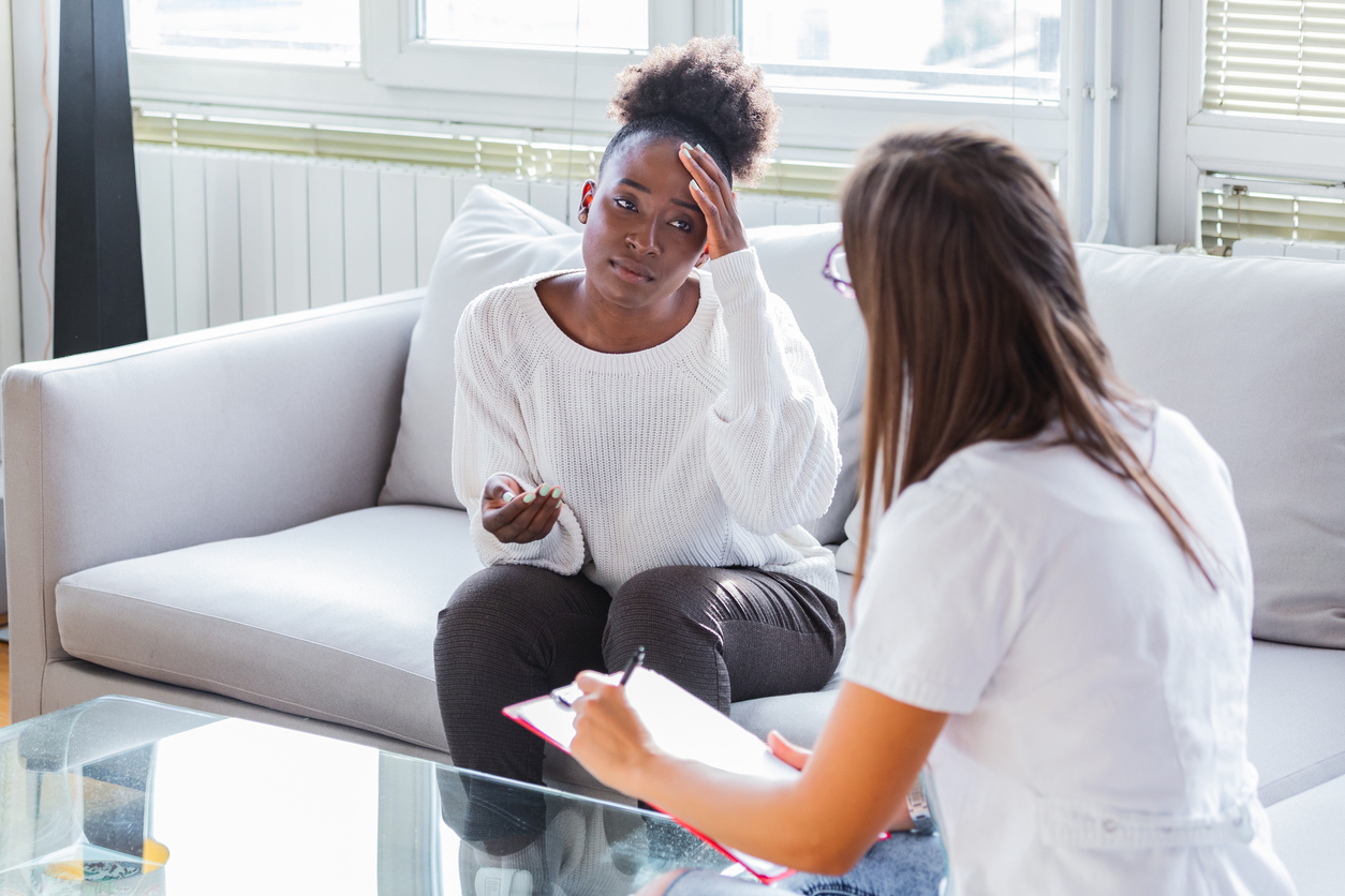 Lawyer speaking with a grieving young woman