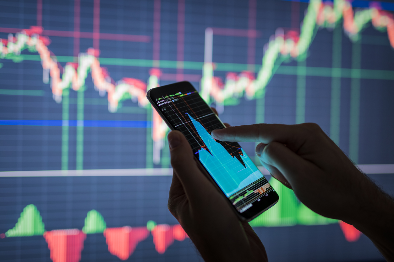 Man checking stock data on smartphone