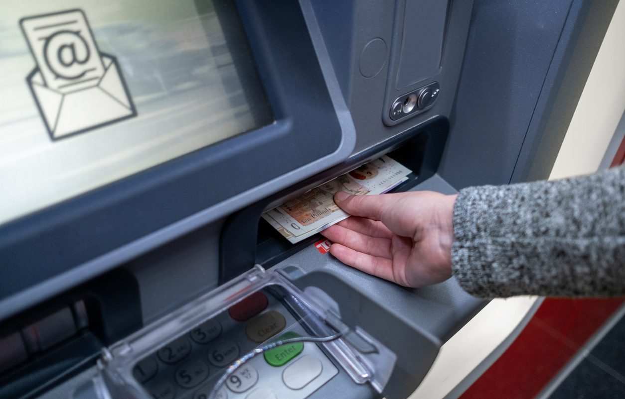 Woman withdrawing cash from an ATM