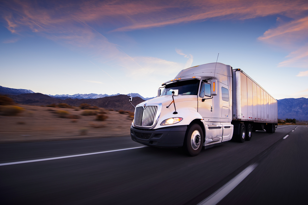 Truck and highway at sunset - transportation