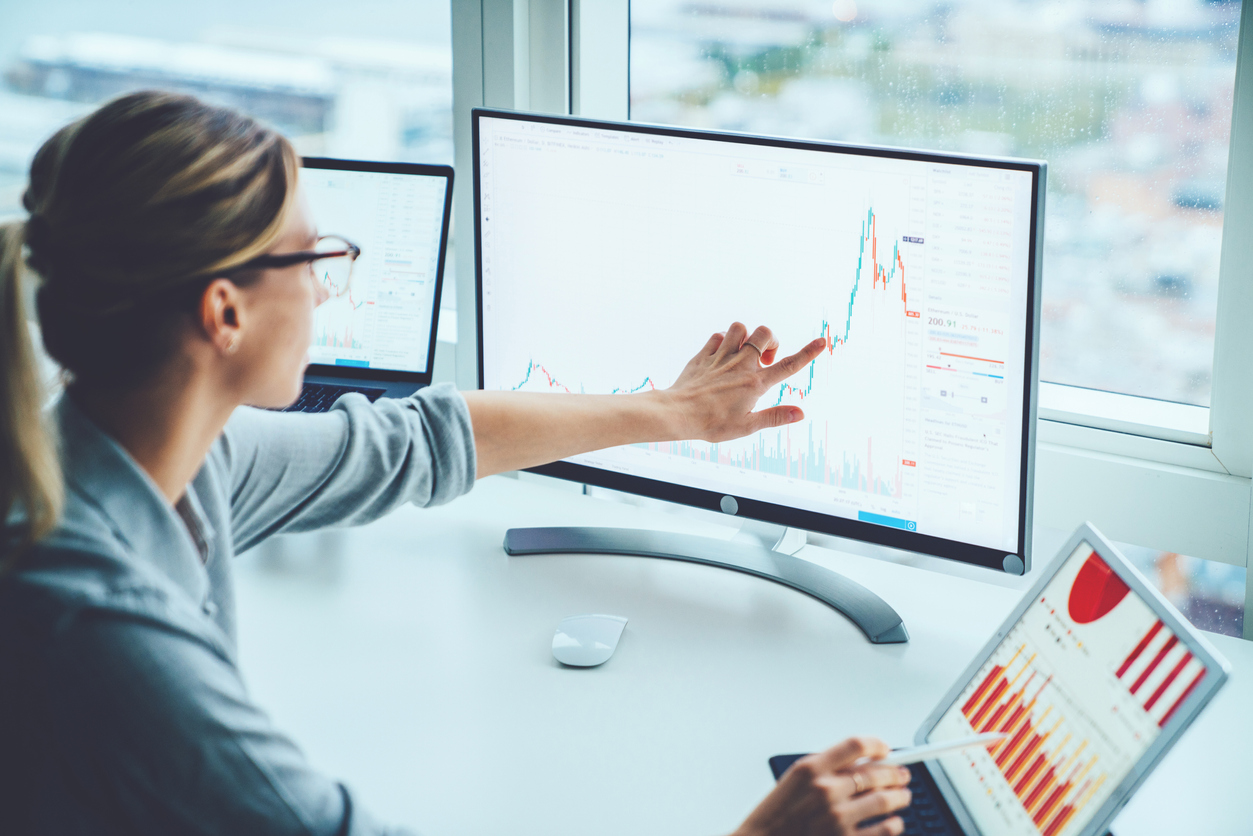 Female accountant using software on a PC