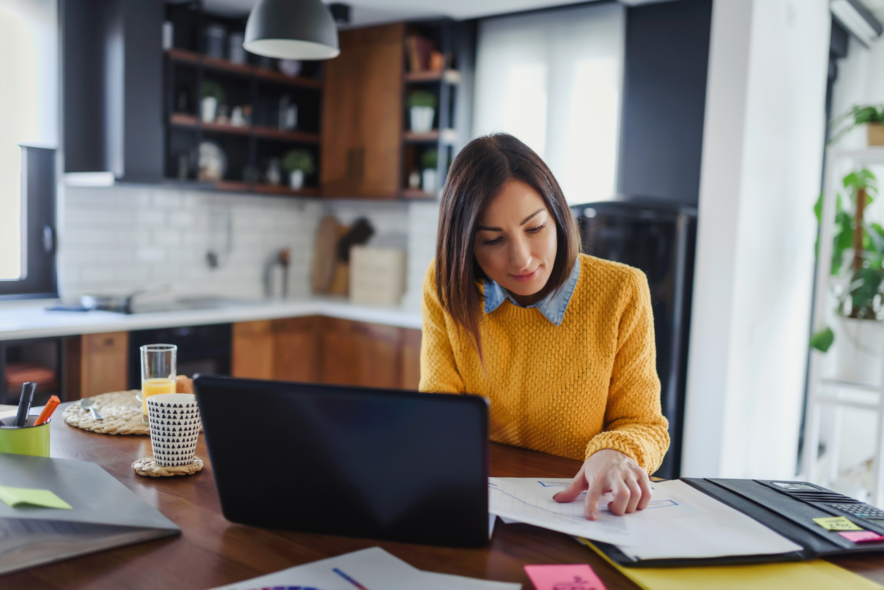 Female solicitor working remotely from her kitchen