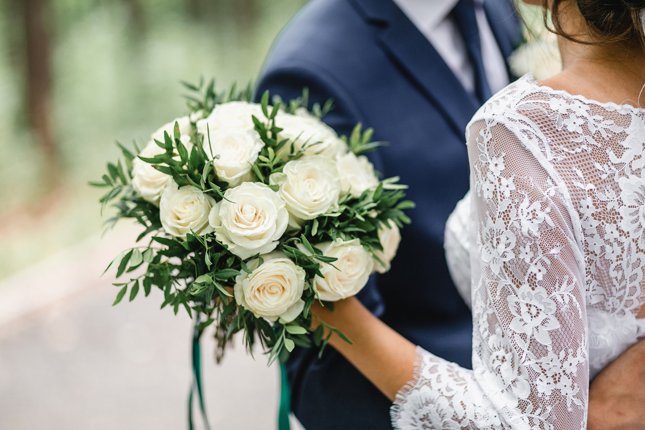 Bride and groom holding flowers