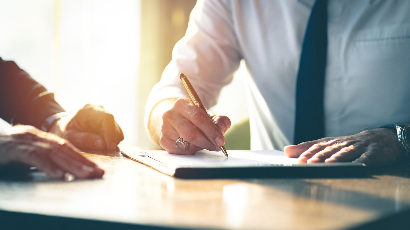 Businessman signing an NDA