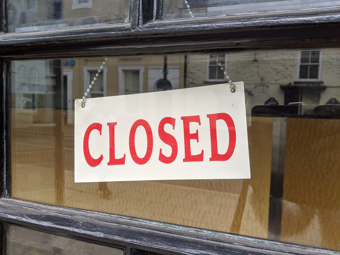 Closed sign hanging in a window