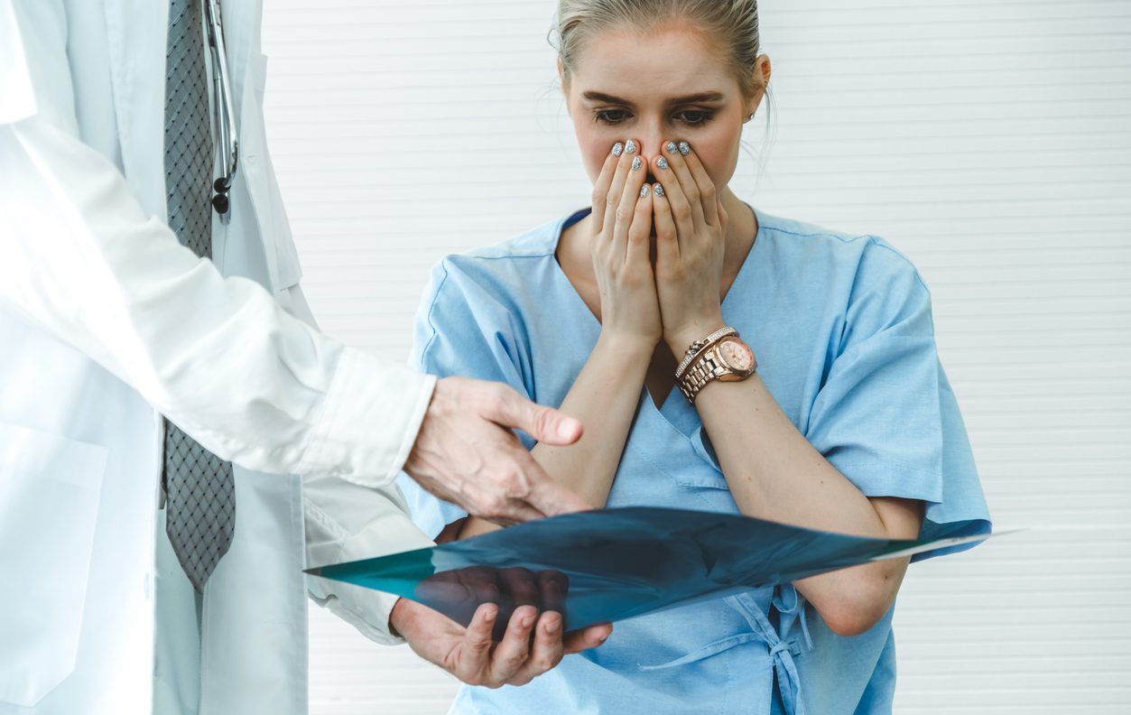 Female patient receiving bad news from a doctor