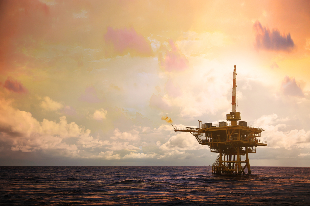 Offshore oil platform in the Gulf of Mexico at sunset