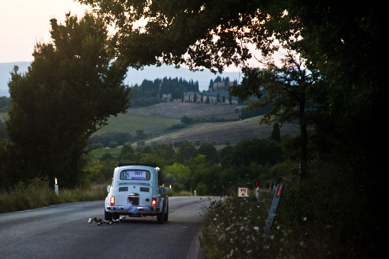 Newlywed couple in car