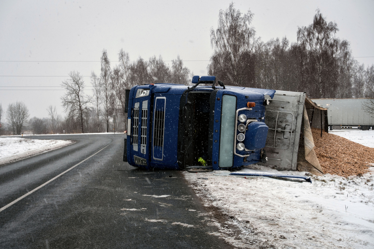 Overturned truck on an icy road