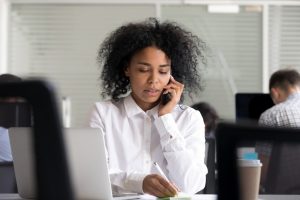 Young professional woman on phone about professional negligence claims