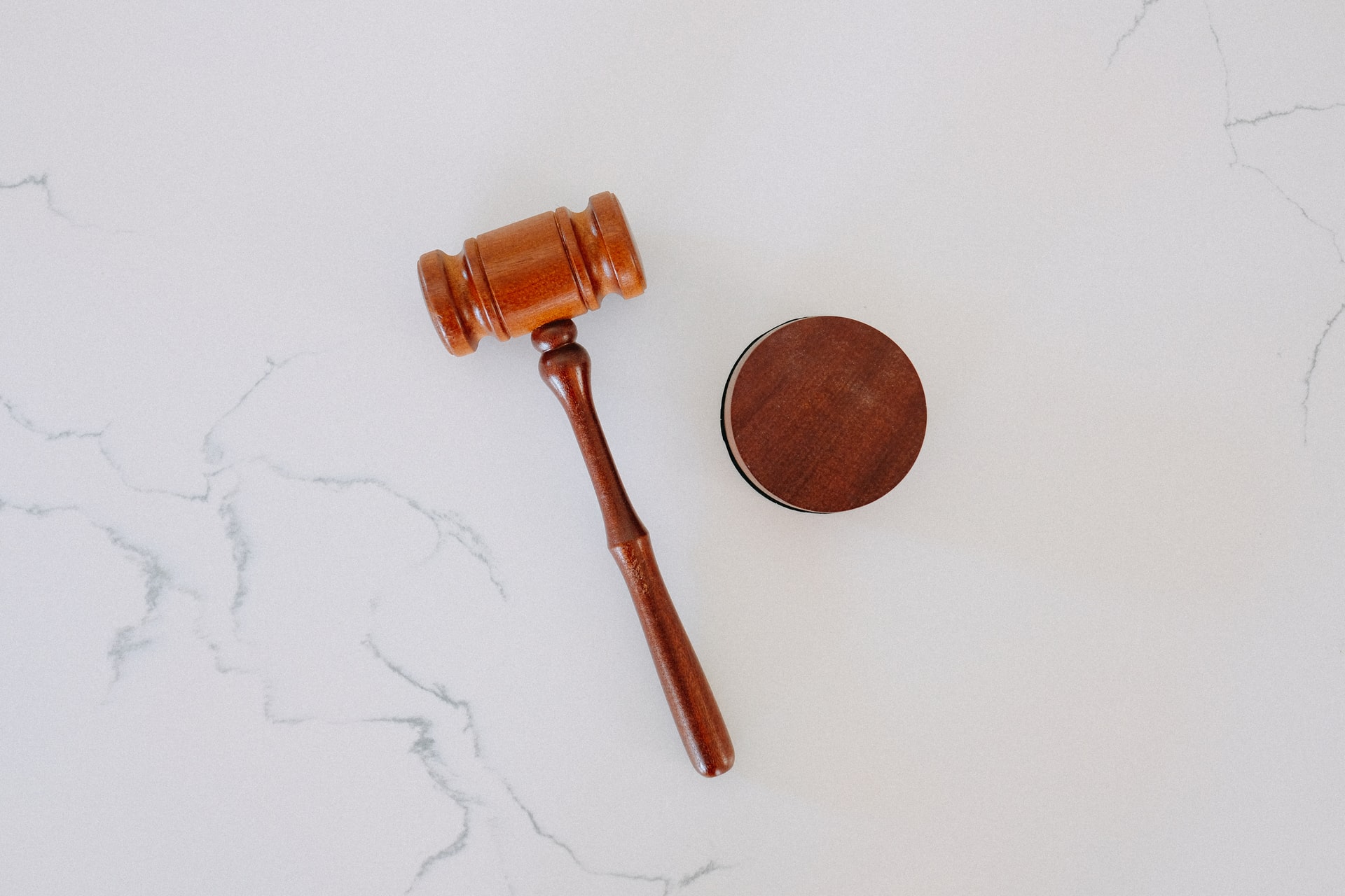 Gavel on white marble surface