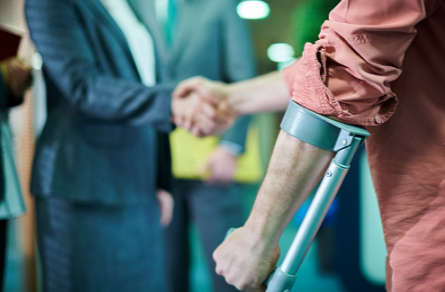 Personal injury lawyer shaking hands with injured client