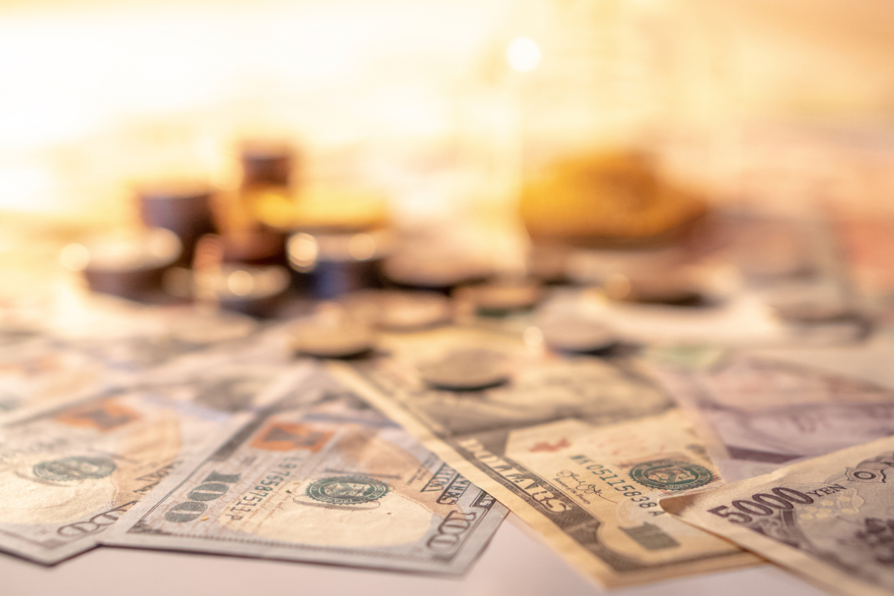 Coins and bank notes on table