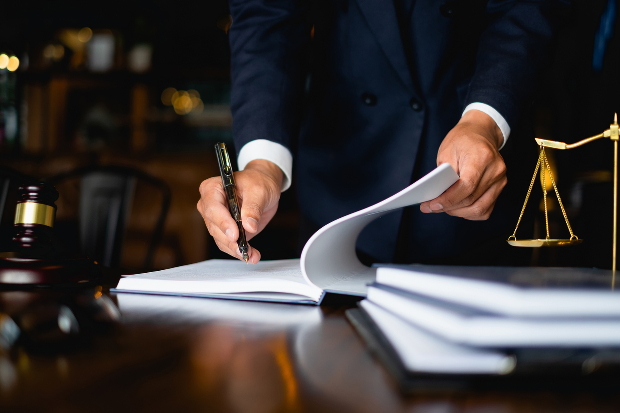 Lawyer signing documents