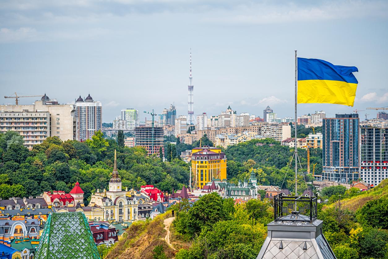 Kyiv, Ukraine cityscape of Kiev and Ukrainian flag