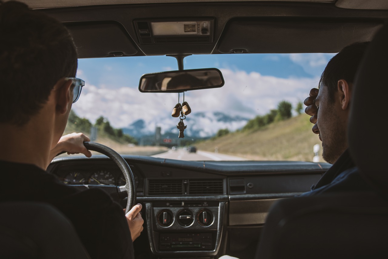 Friends driving in car