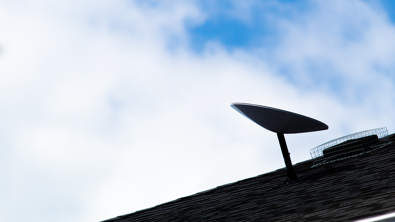 A SpaceX Starlink satellite dish is seen installed on a roof of a home