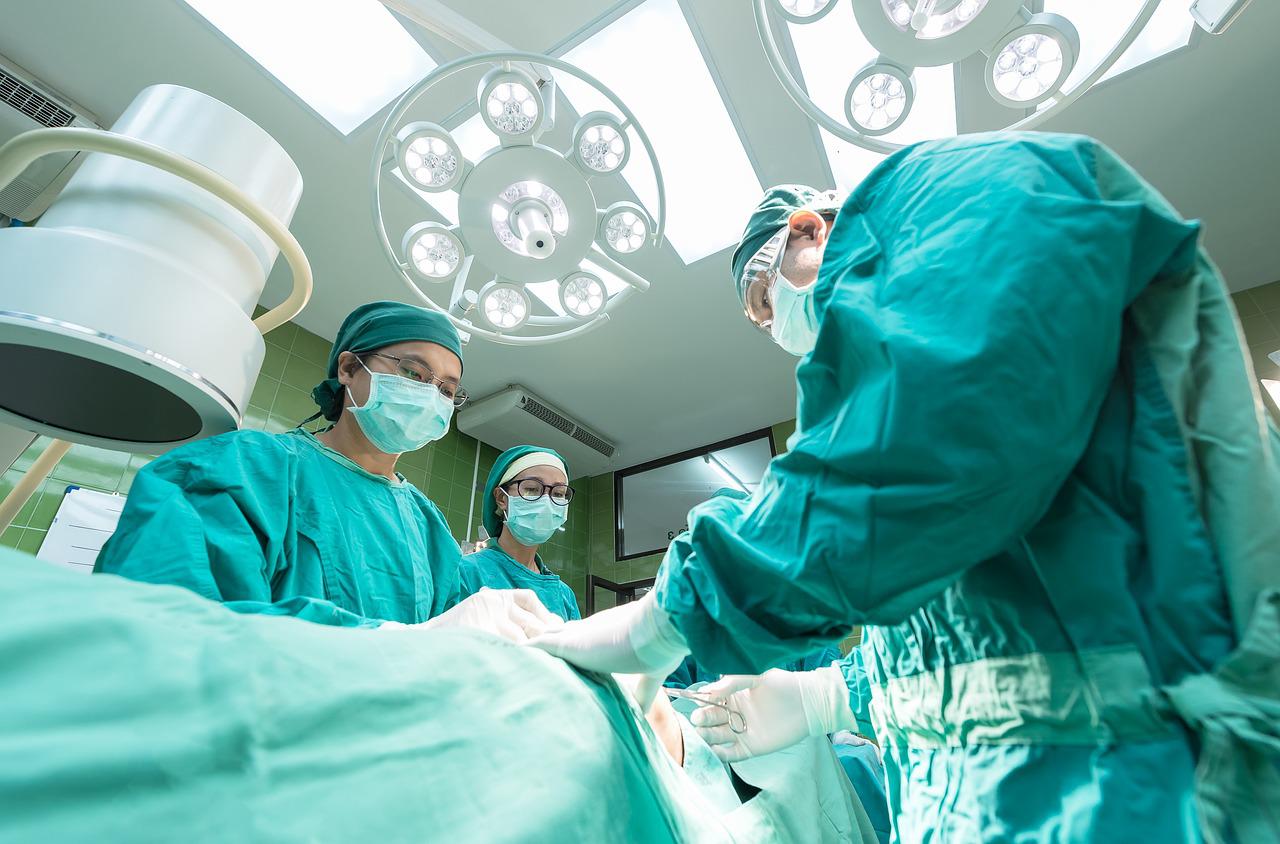 Surgeons operating on patient