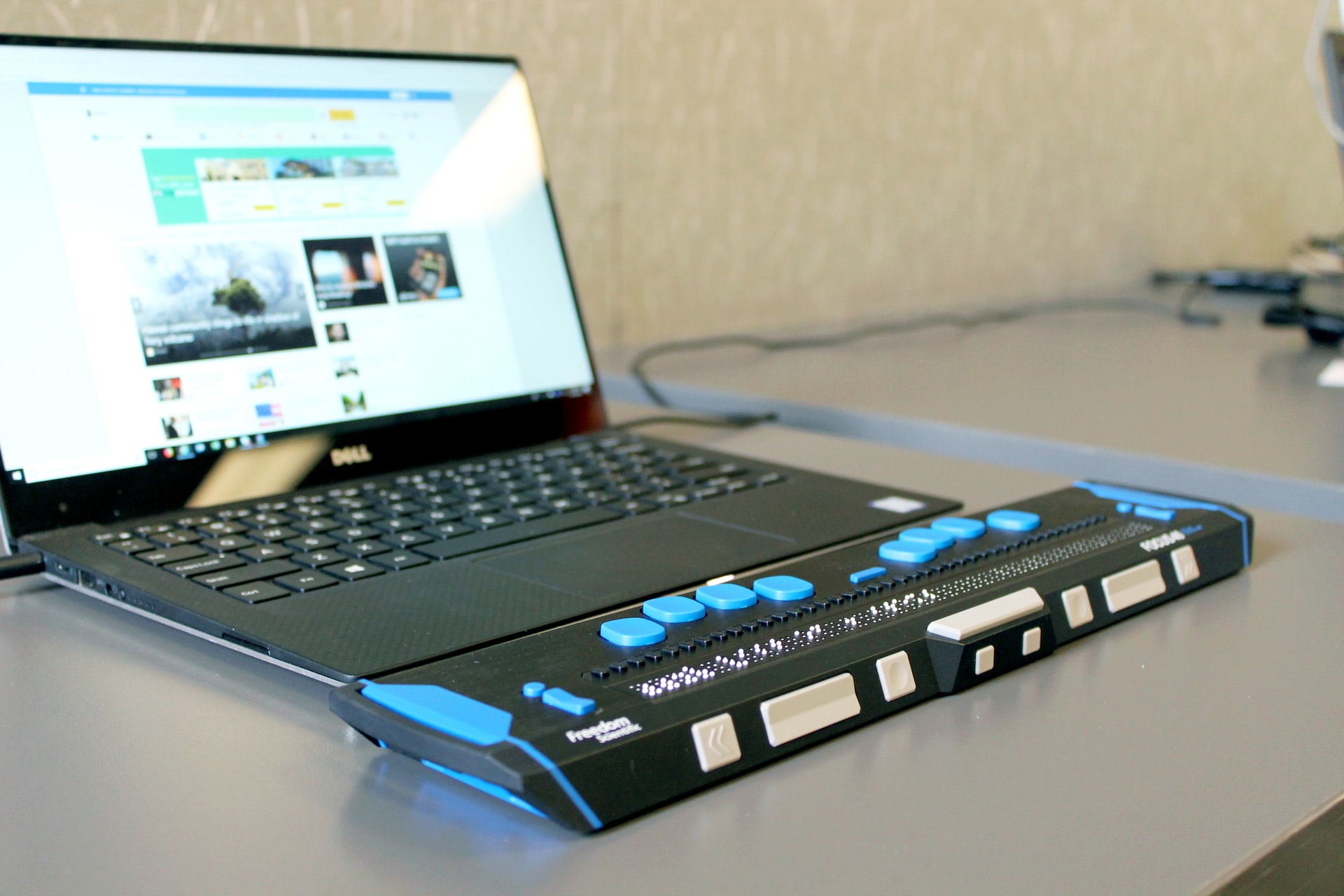 Laptop with braille display for disabled employee