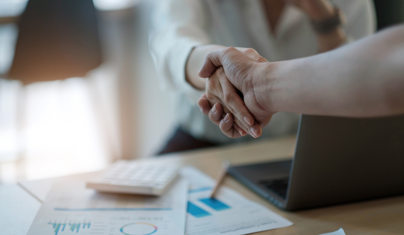 Business people shake hands on deal