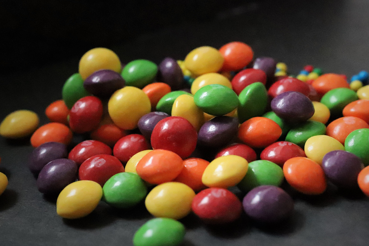 Skittles on black background