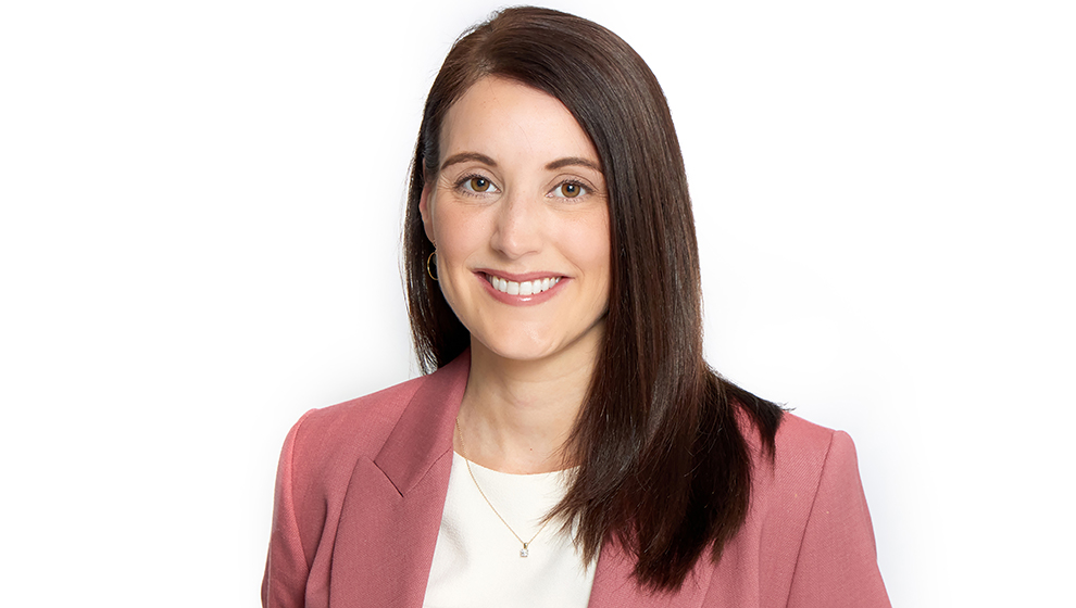 Female intellectual property lawyer in a white room.