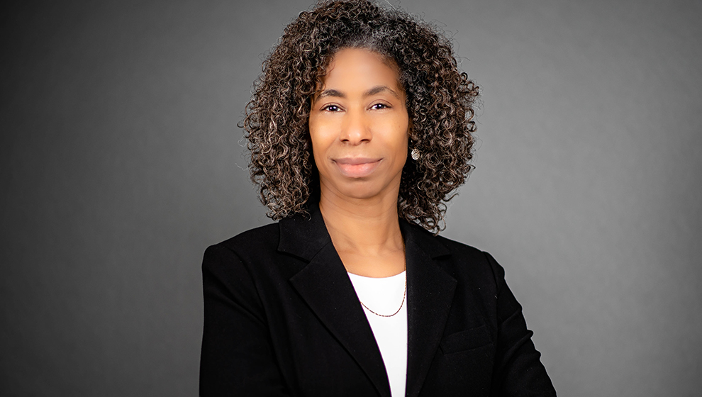 Young female appellate lawyer in plain room.