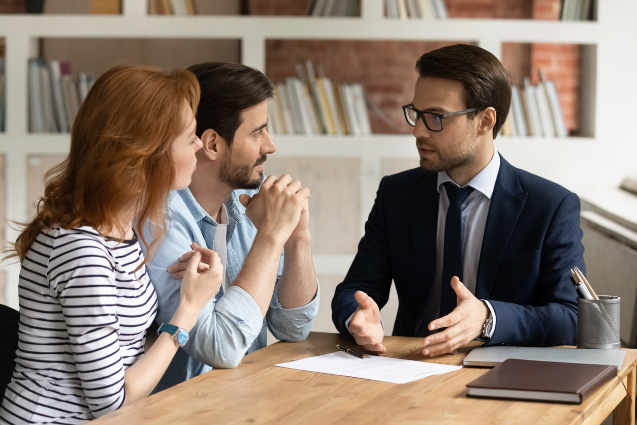 Young couple meeting with lawyer