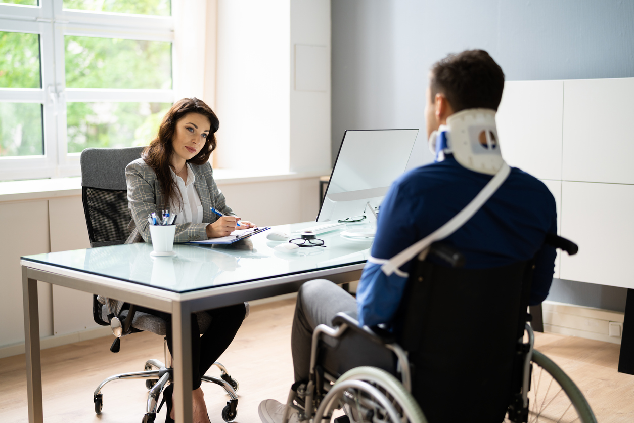 Personal injury lawyer meeting with a client.