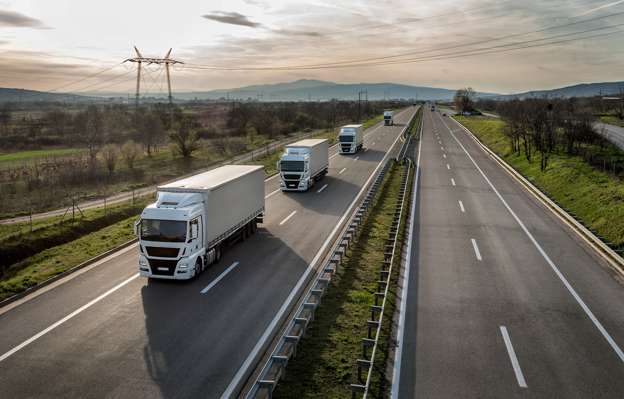 Trucking convoy transporting goods.