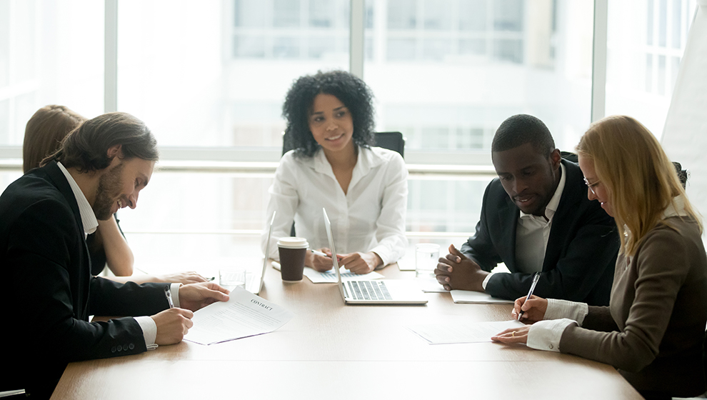 Executives negotiating in a boardroom.