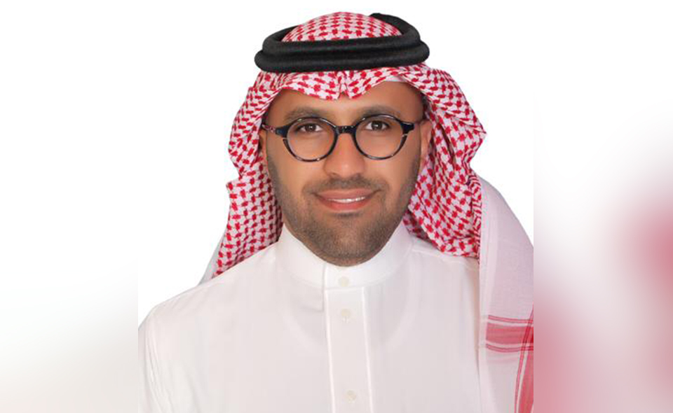 Saudi Arabian ADR specialist in front of white background.